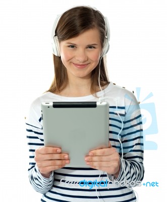 Smiling Girl Holding I-pad Stock Photo