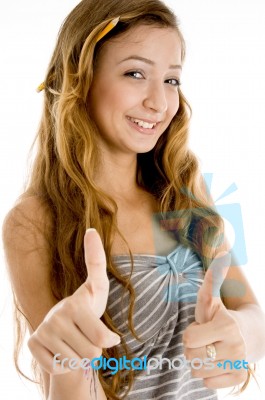 Smiling Girl Showing Thumb Up Stock Photo