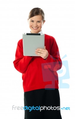 Smiling Girl Using Tablet Pc Stock Photo