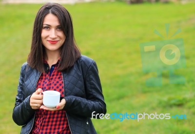 Smiling Girl With White Coffee Cup Stock Photo