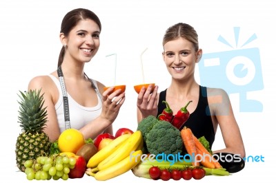 Smiling Girls Holding Juicy Slice Of An Orange Stock Photo