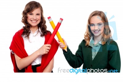 Smiling Girls Making Cross Sign Stock Photo
