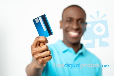 Smiling Guy Holding Credit Card Stock Photo