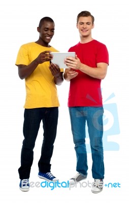 Smiling Guys Using Tablet Pc Stock Photo