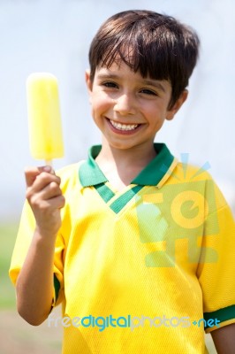 Smiling Kid Holding An Ice-cream Stock Photo