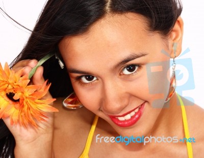 Smiling Lady Inserting Flower Stock Photo