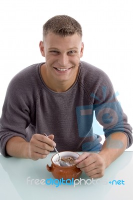 Smiling Man Eating Cornflakes Stock Photo