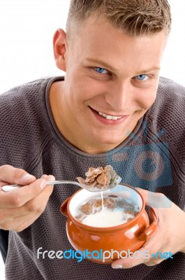 Smiling Man Eating Cornflakes Stock Photo