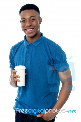 Smiling Man Holding Cold Beverage Stock Photo