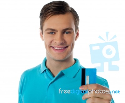 Smiling Man Holding Credit Card Stock Photo