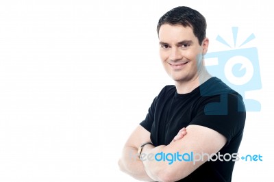 Smiling Man With Folded Arms Stock Photo