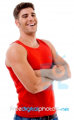 Smiling Muscular Man Posing With Crossed Arms Stock Photo