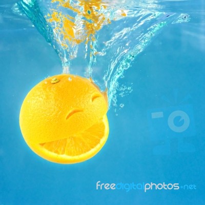 Smiling Orange In Water Stock Photo