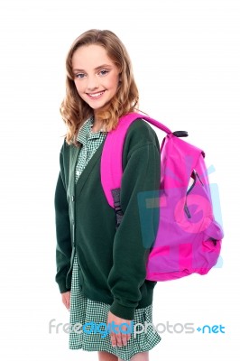 Smiling school girl carrying bag Stock Photo