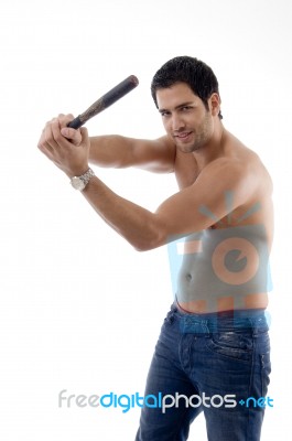 Smiling Strong Man With Wooden Stick Stock Photo