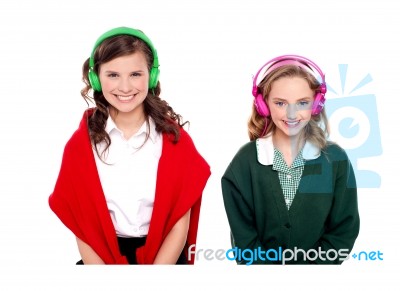 Smiling students Listening Music Stock Photo