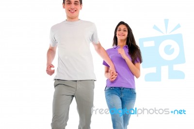 Smiling Teenage Couple Running Stock Photo