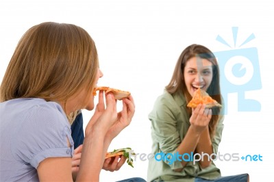 Smiling Teenage Girls Eating Pizza Stock Photo