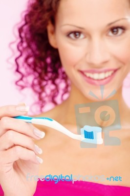 Smiling Woman And Teeth Brush Stock Photo