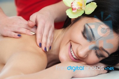Smiling Woman Relaxing During Back Massage At Spa Stock Photo