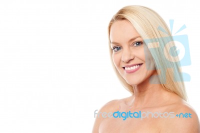 Smiling Woman With Bare Shoulders Stock Photo