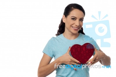 Smiling Woman With Heart Shape Gift Box Stock Photo