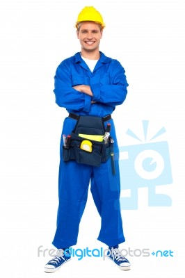 Smiling Worker With Crossed Arms Stock Photo