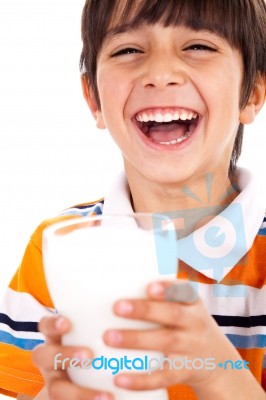 Smiling Young Boy Holding A Glass Of Milk Stock Photo