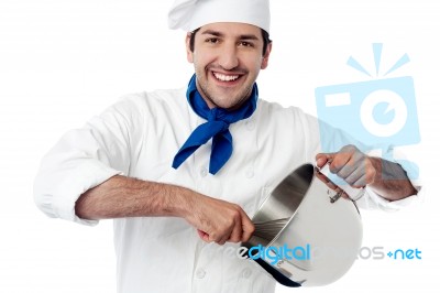 Smiling Young Chef Holding Vessel Stock Photo