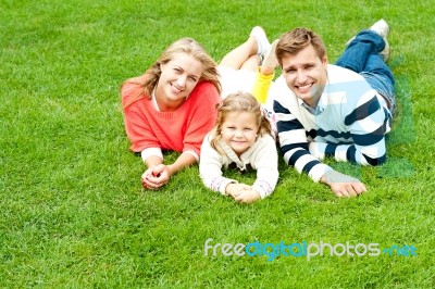 Smiling Young Family In Outdoors Stock Photo