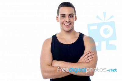 Smiling Young Fitness Guy, Arms Crossed Stock Photo