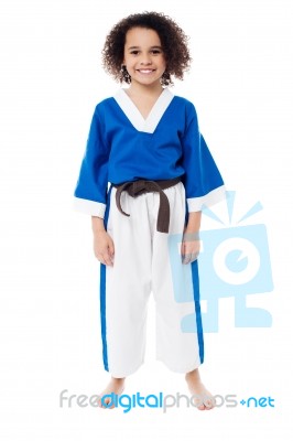 Smiling Young Girl In Karate Uniform Stock Photo