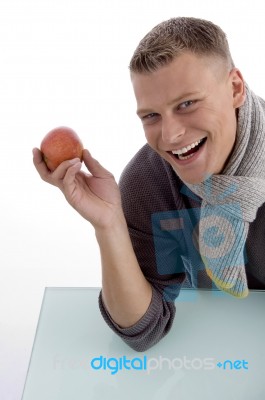 Smiling Young Male Posing With Apple Stock Photo