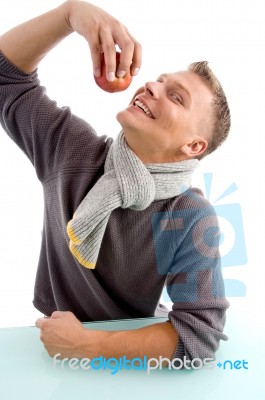 Smiling Young Man Going To Eat Apple Stock Photo