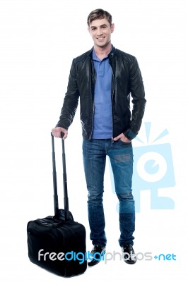 Smiling Young Man Going To Travel Stock Photo