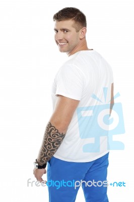 Smiling Young Man With Tattoo Stock Photo
