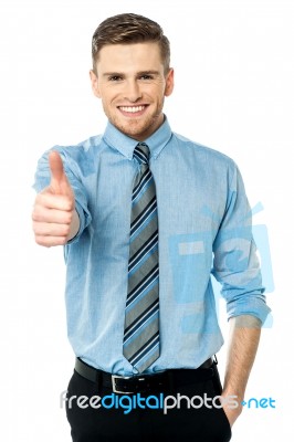 Smiling Young Man With Thumbs Up Gesture Stock Photo
