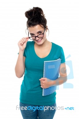 Smiling Young Student Holding Book Stock Photo