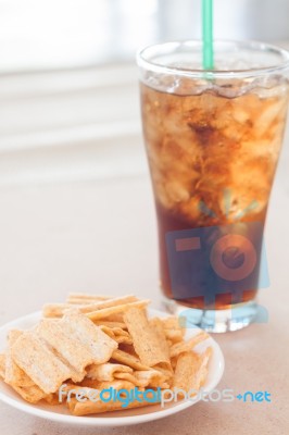 Snack On White Plate With A Glass Of Cola Stock Photo