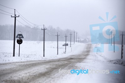 Snowfall And Sleet On Winter Road. Ice Snowy Road. Winter Snowst… Stock Photo