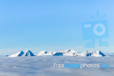 Snowy Mountains And Clouds Stock Photo