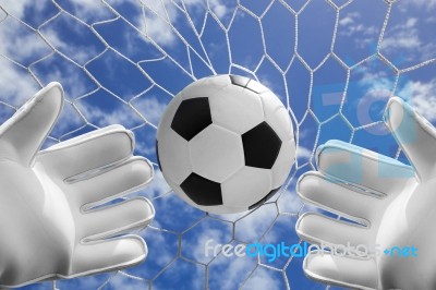 Soccer Ball In Goal Net With Blue Sky Stock Photo