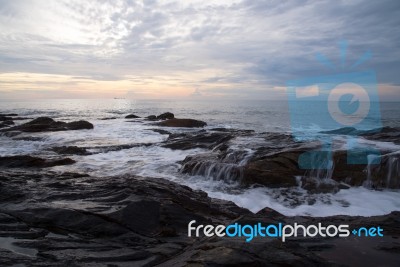 Soft Waves Attract On Rocks Stock Photo