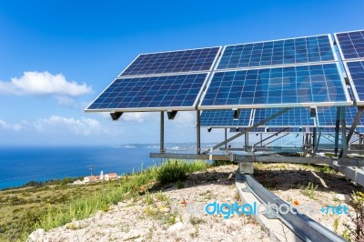 Solar Panels Near Blue Sea And Monastry Stock Photo