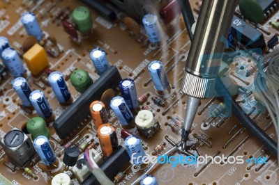 Soldering Iron On Electronic Boards Stock Photo