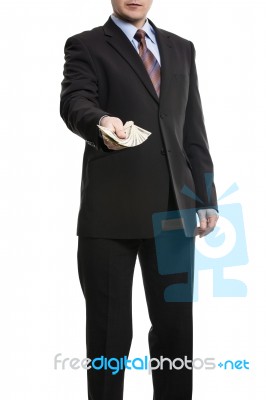 Some Unrecognizable Businessman In Suit Showing  A Spread Of Cas… Stock Photo