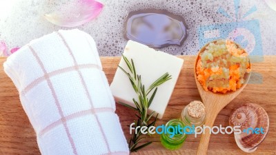 Spa And Wellness Treatment Setup On Wooden Panel Stock Photo