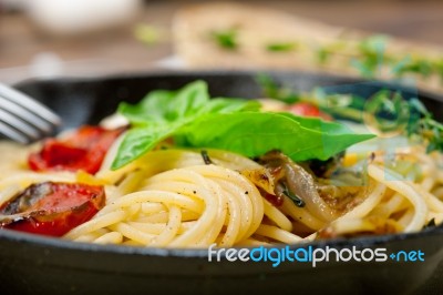 Spaghetti Pasta With Baked Cherry Tomatoes And Basil Stock Photo
