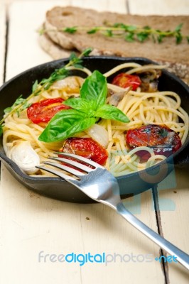 Spaghetti Pasta With Baked Cherry Tomatoes And Basil Stock Photo