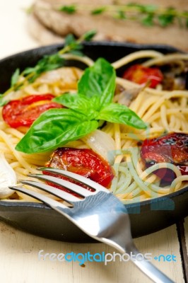 Spaghetti Pasta With Baked Cherry Tomatoes And Basil Stock Photo